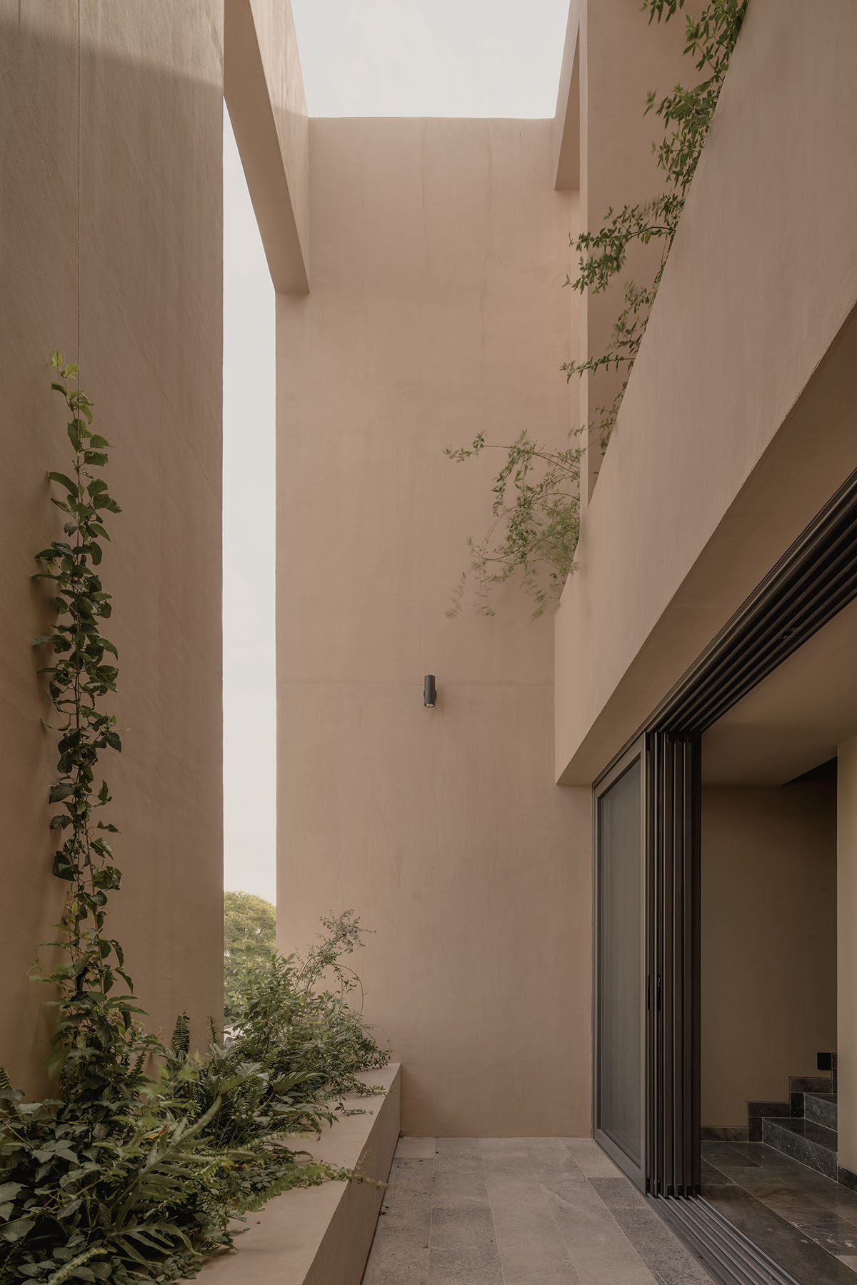 Taller Segovia Molina enriches beige Casa Aguilar with interior patios and an abundance of light