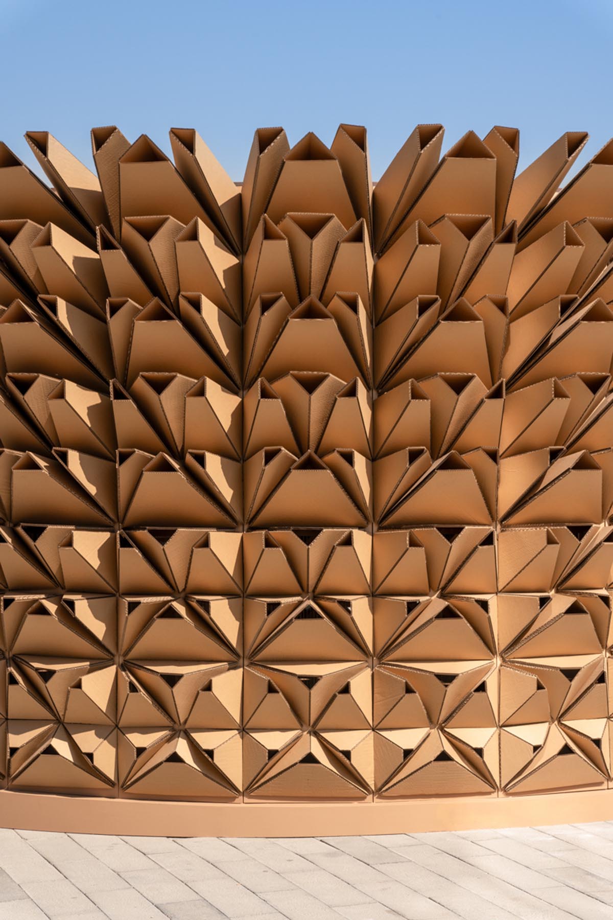 Deond wraps pavilion with 3D corrugated cardboards referencing