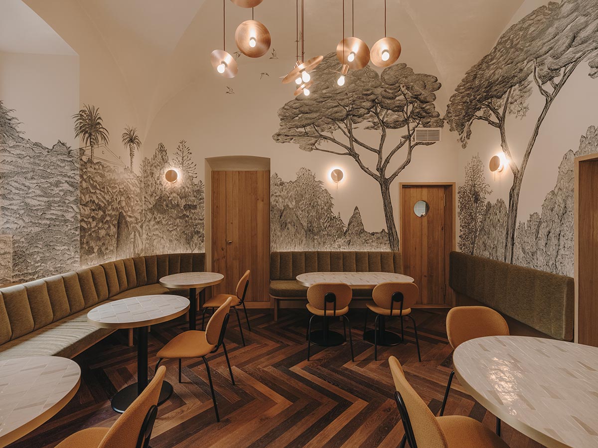 El Equipo Creativo converts 18th-century palace into hotel with rich textures and colors in Girona