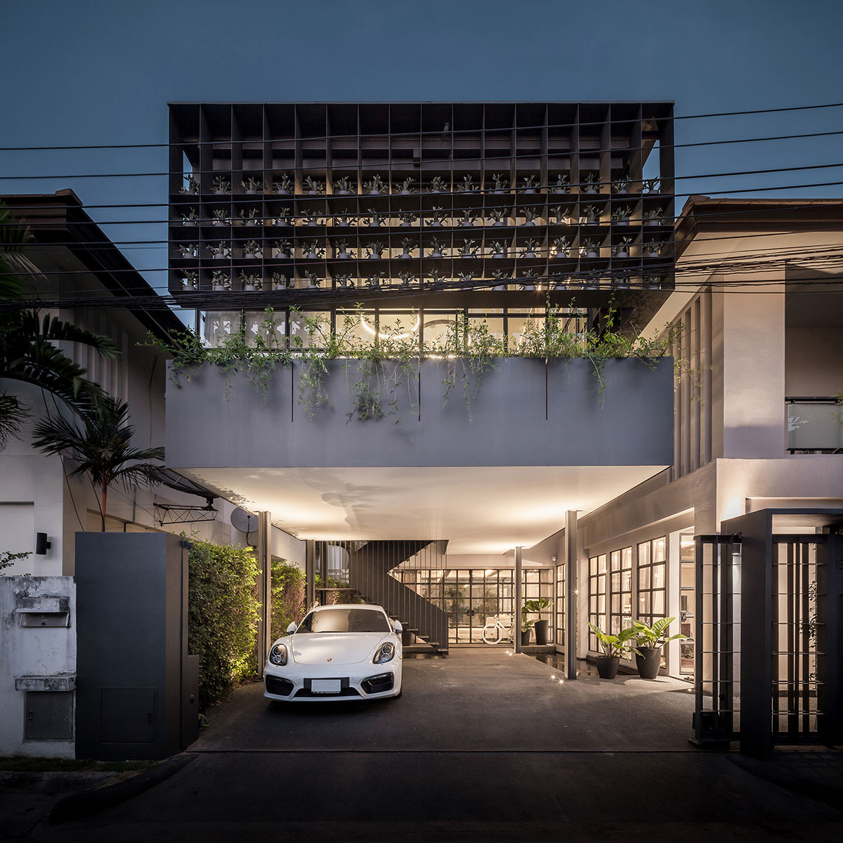 Anonym Studio renovated Bangkok’s old house with steel flower beds to create more openness
