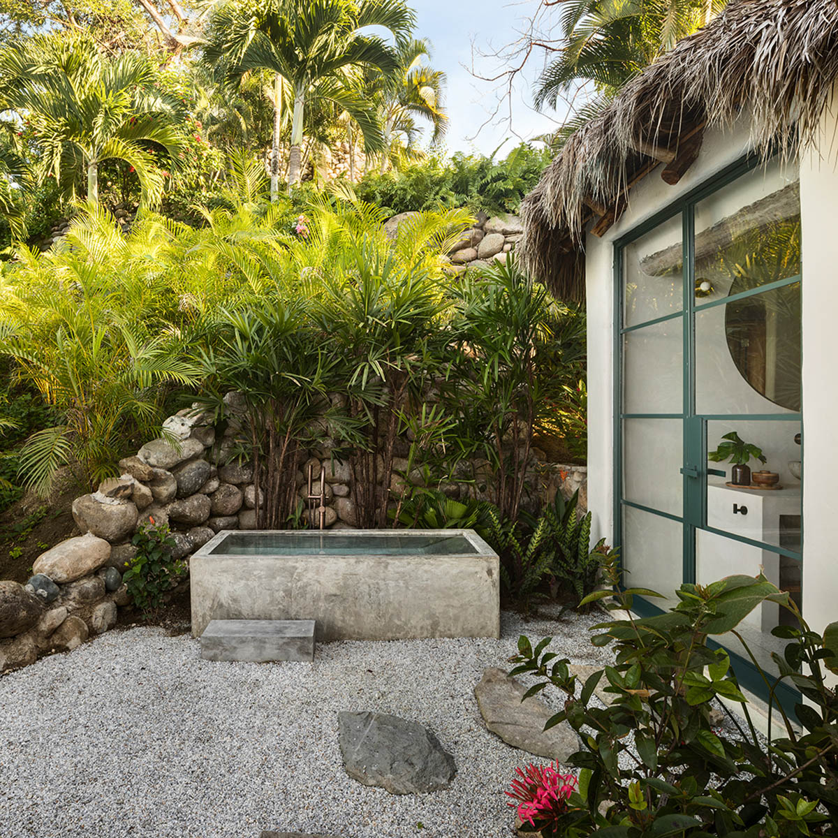 MAIN OFFICE adds half-circle yoga platform to thatched-roof guest villas in Sayulita, Mexico