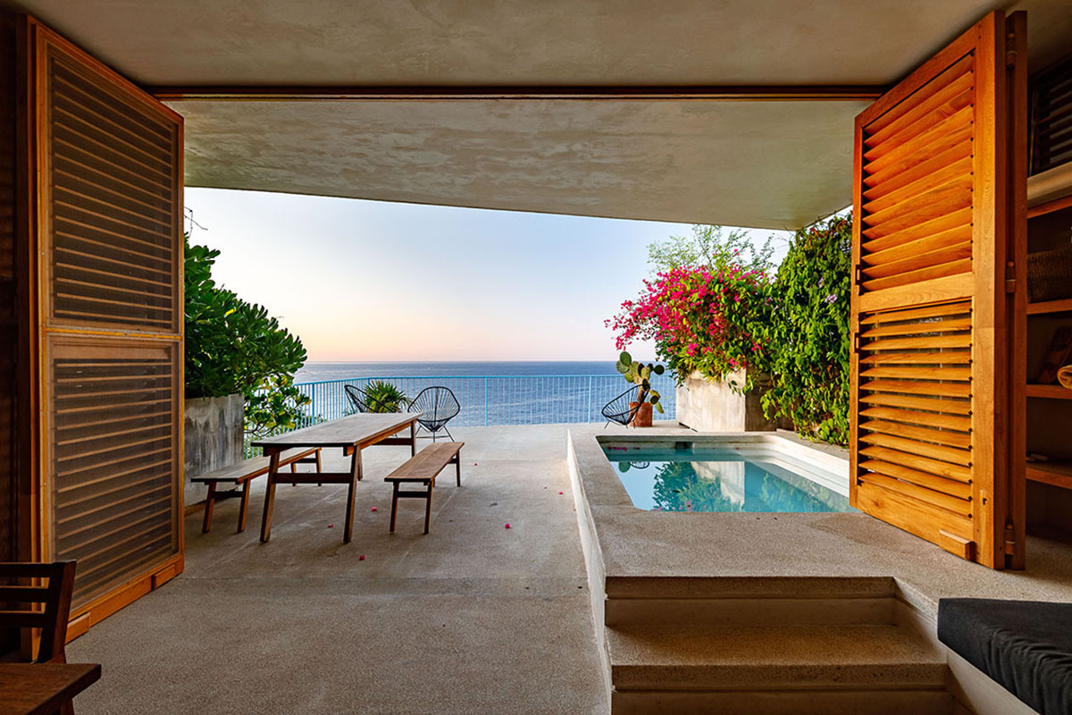 Francisco Pardo Arquitecto's housing features circular  pool overlooking the coastal landscape