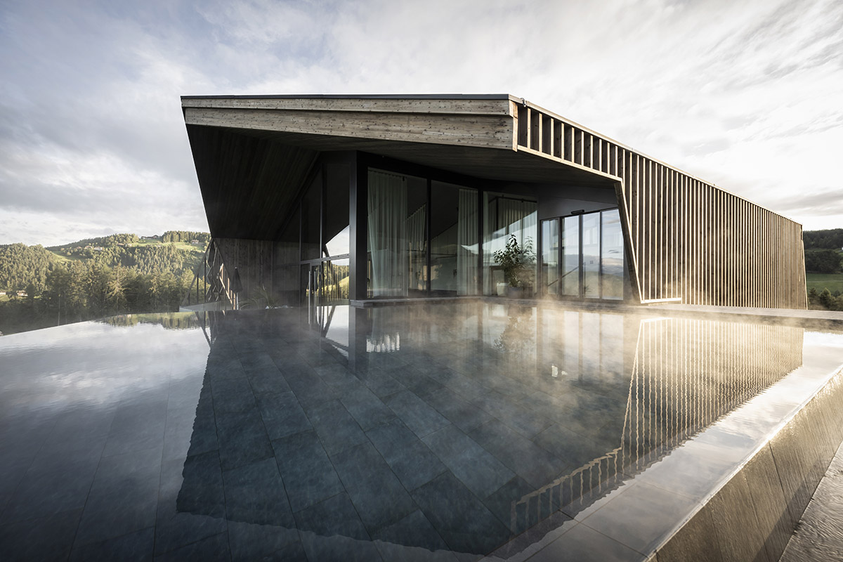 noa* designs boutique hotel and wellness featuring trapezoidal façade in an old farm of Soprabolzano
