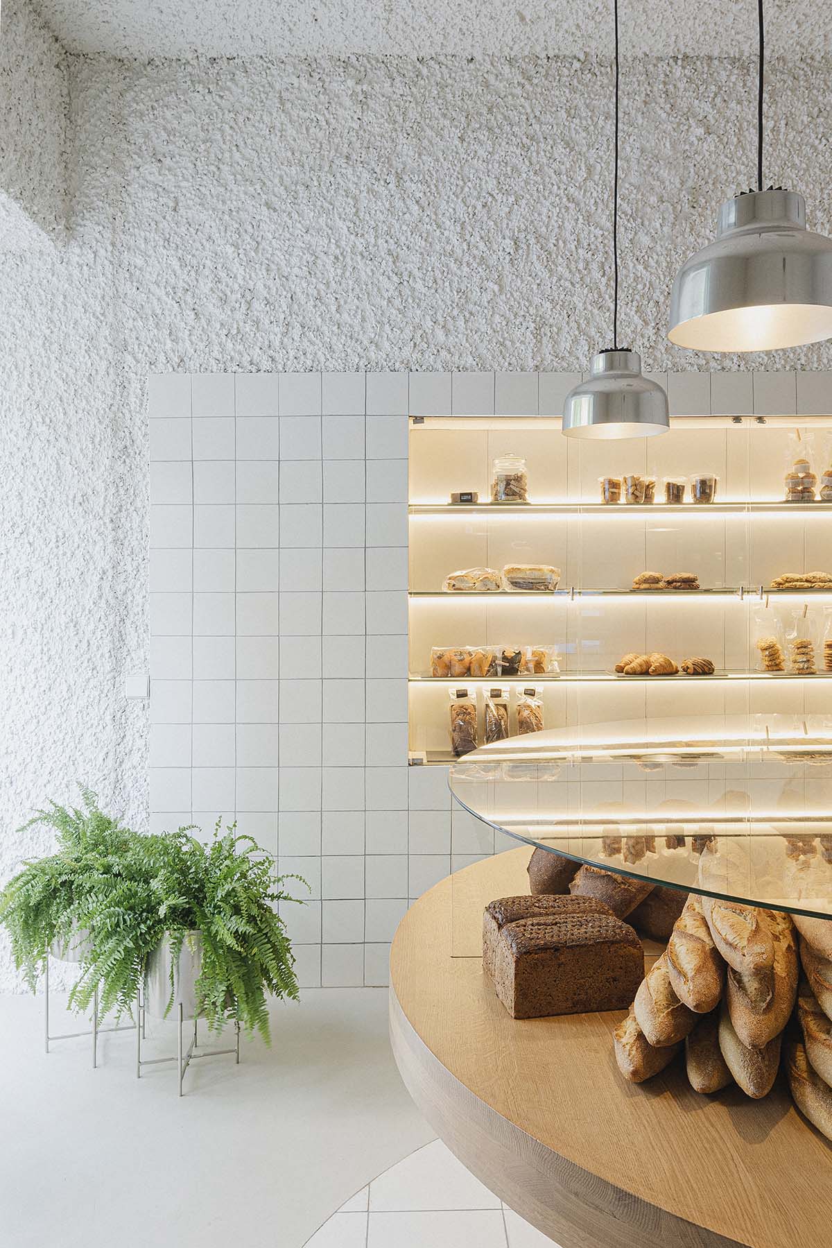 Bakery features central oak tables that revive the traditional dining room experience 