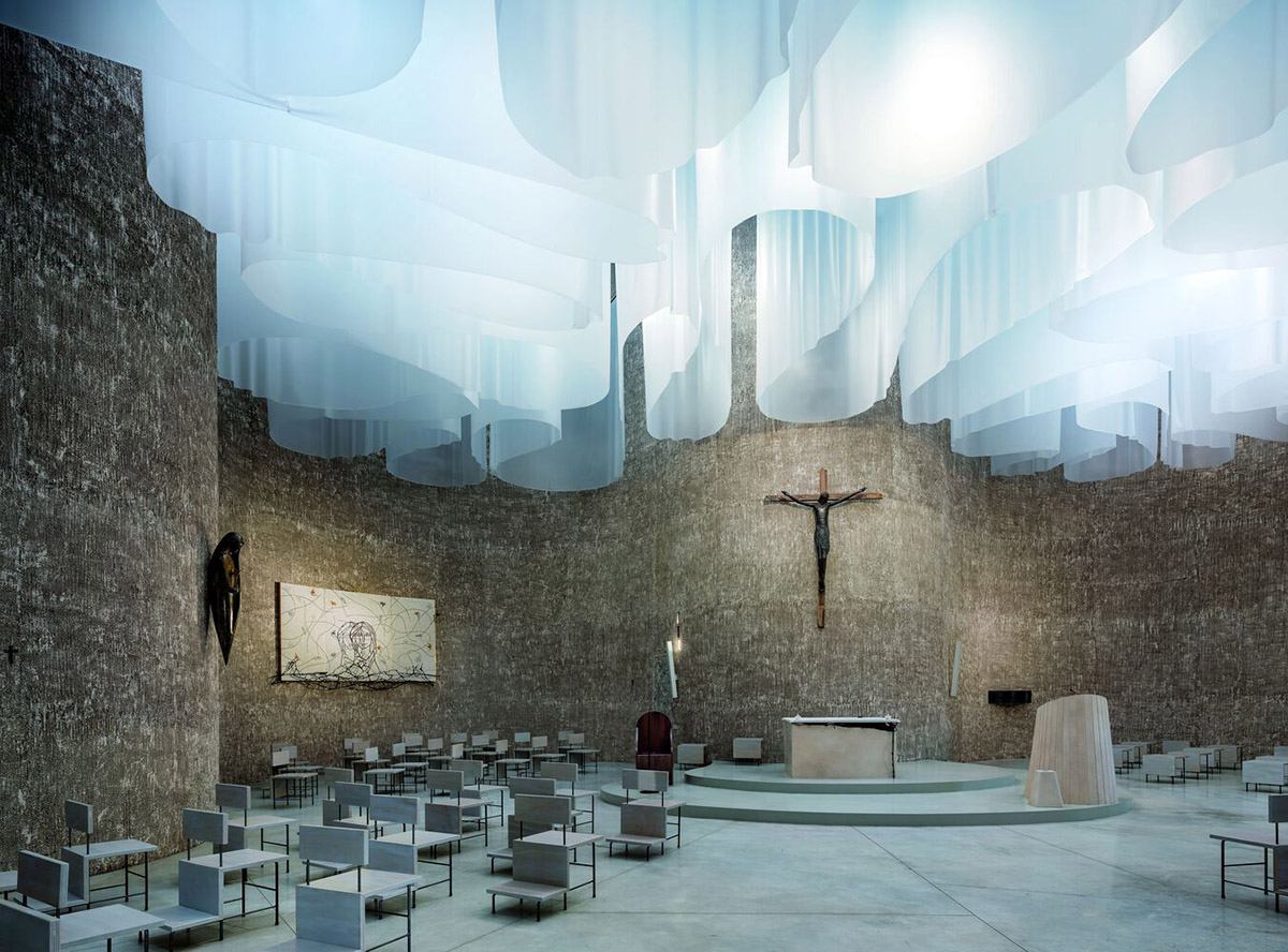Smooth all-white walls form church designed by Mario Cucinella Architects in Mormanno hill town 