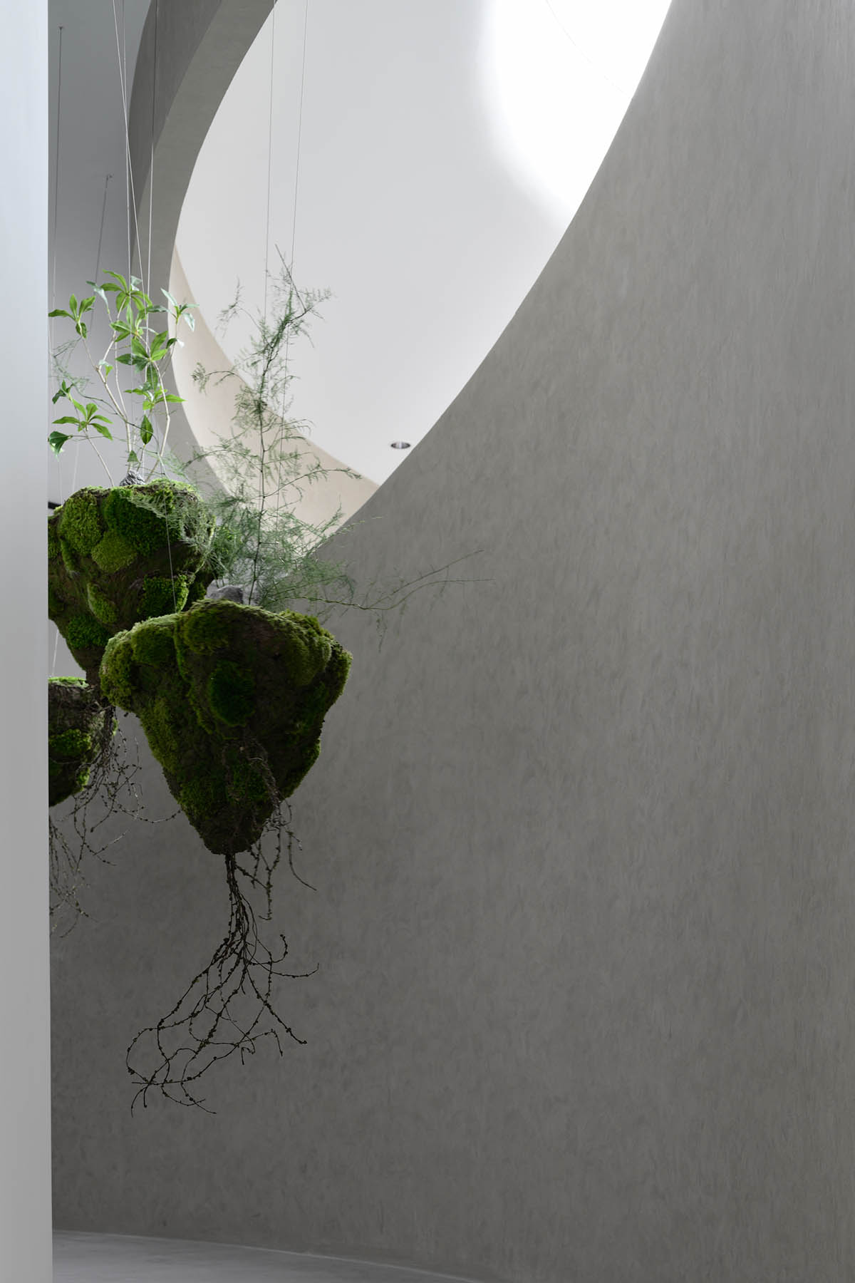 Exhibition hall interiors in China feature unconstrained flowing wall evoking