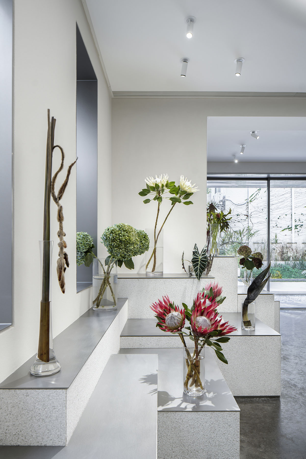 More Design Office's Absolute Flower Shop features cellular spaces with flower arrangements