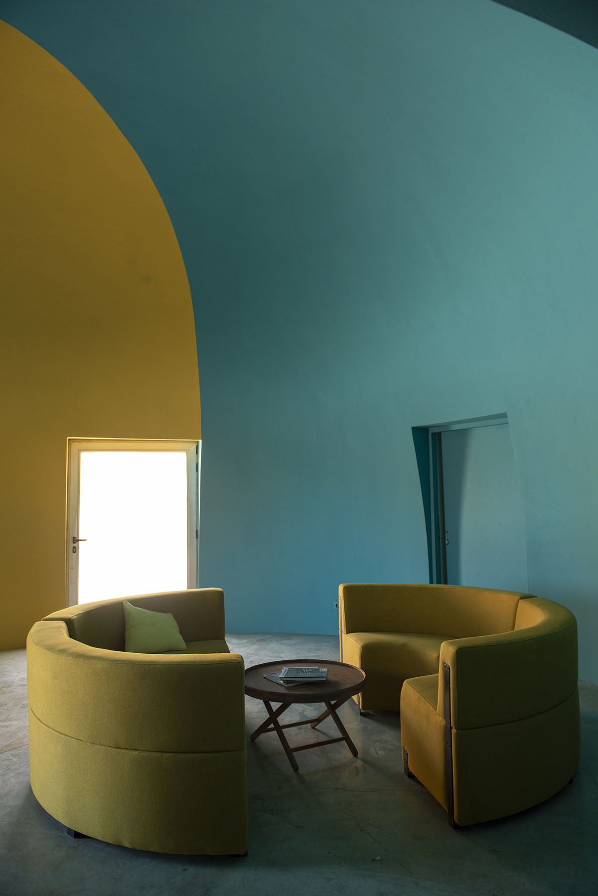 ZAV Architects built colorful-domed housing made of rammed earth and sand on Hormuz island, Iran