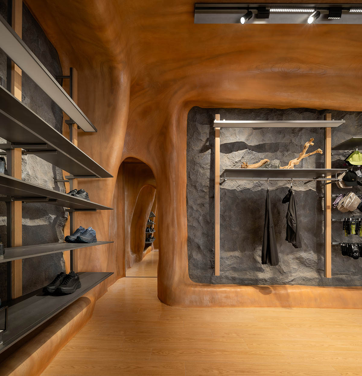 STILL YOUNG creates cave-like interiors for a store with wood and rock elements in Beijing 