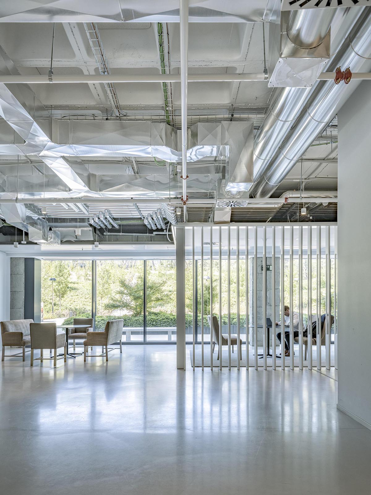 Perkins&Will converts former corporate complex into a people-focused workplace design in Madrid