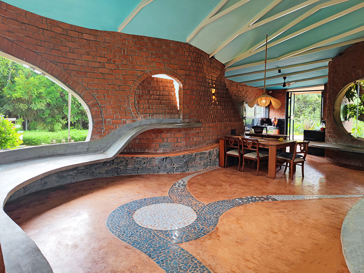 Organically-arranged brick walls form biophilic Asmalay house by Blurring Boundaries in India 