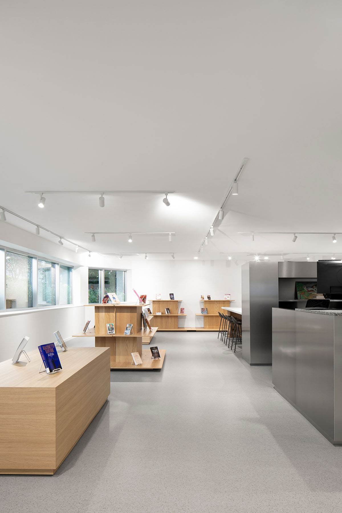 Whitish glass library designed by ACDF Architecture acts as a white floating volume in Quebec