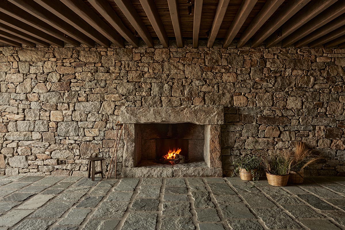 Terraced stonewalls sprawl down to offer an exploratory route in an old vineyard in Samos