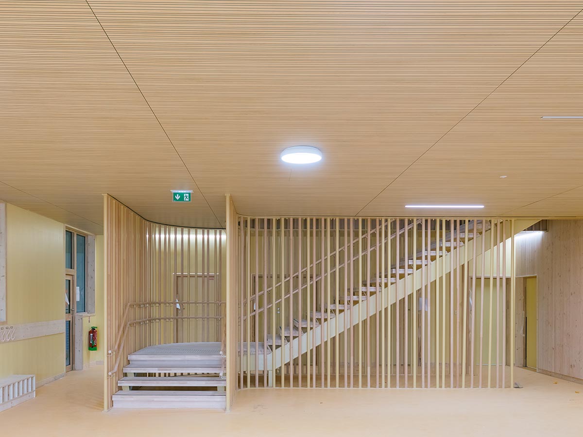 Wooden school by r2k architecte is inspired by Nordic architecture to be a positive energy building