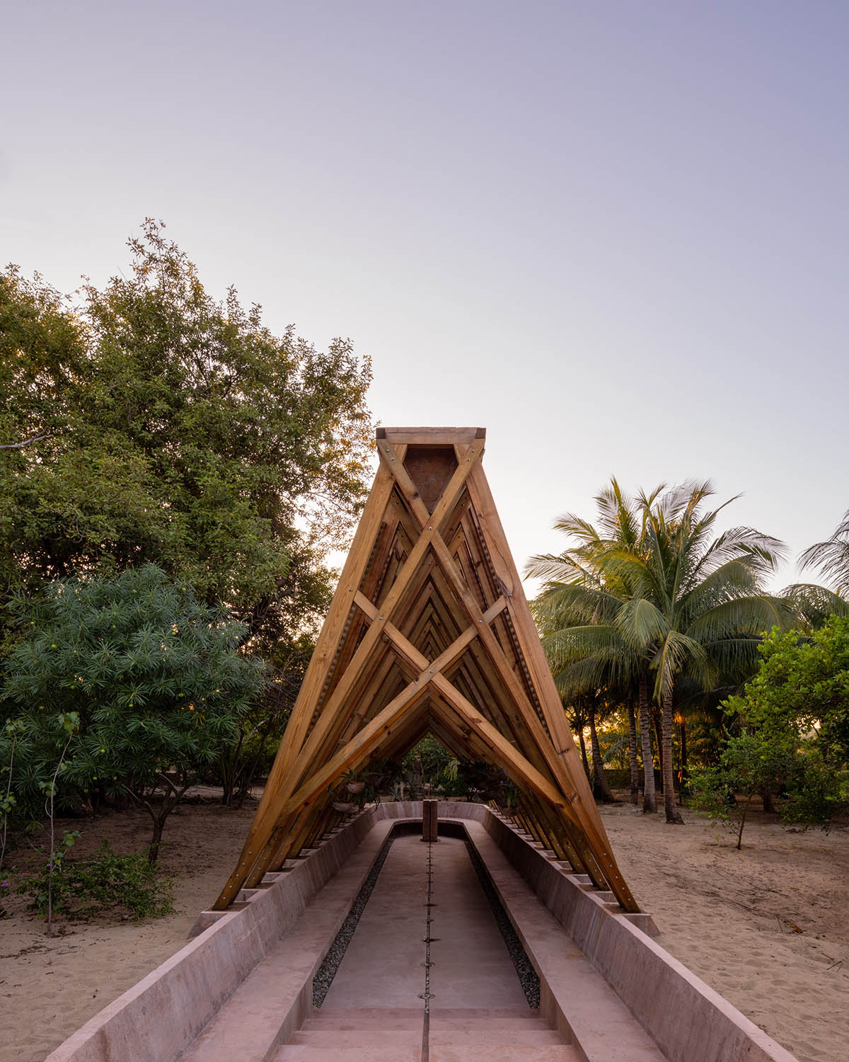 Centro de Colaboración Arquitectónica completes wooden Orchid Pavilion for Casa Wabi in Mexico