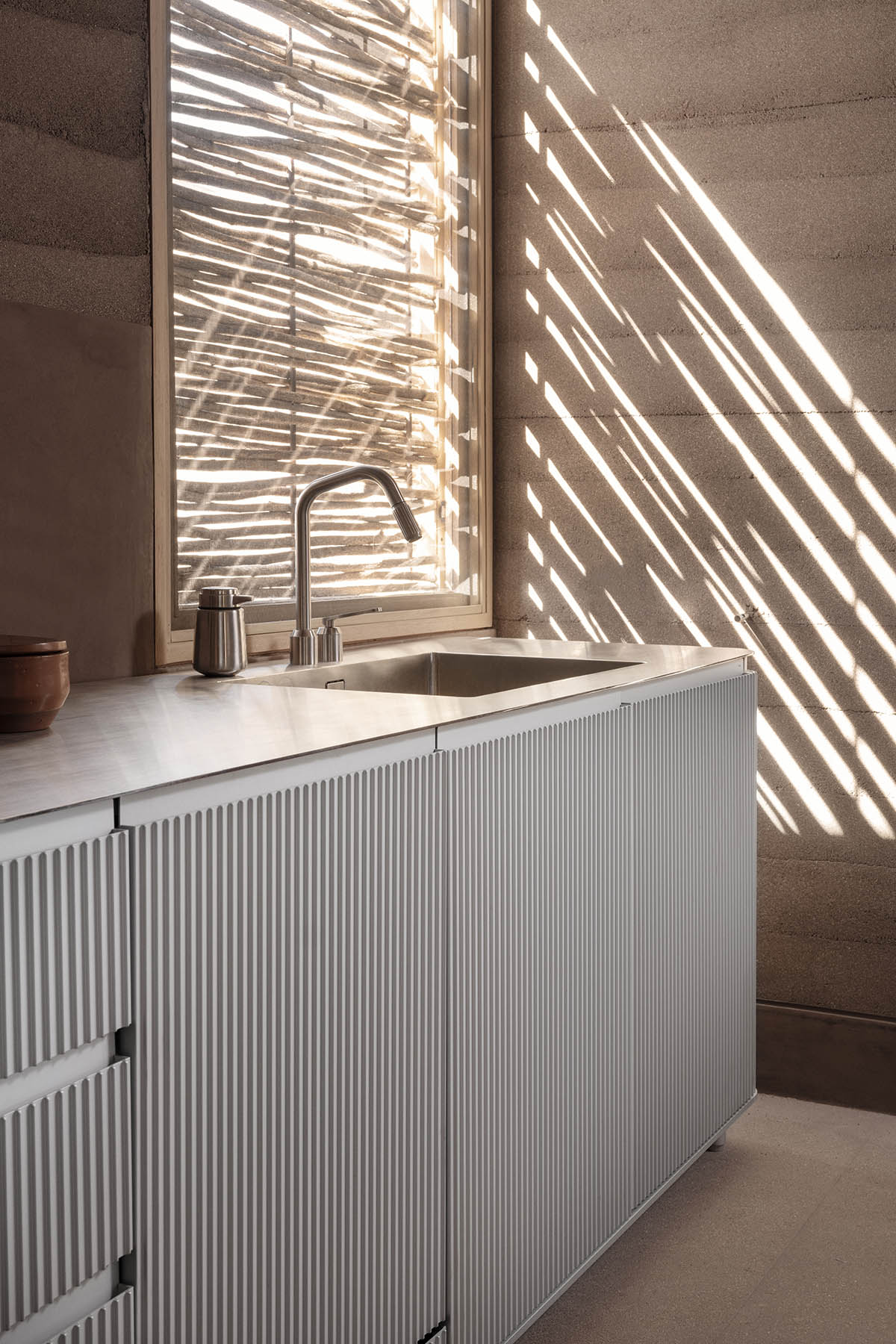 Rammed earth guesthouse by PPAA blends Mexican and Danish influences in Todos Santos