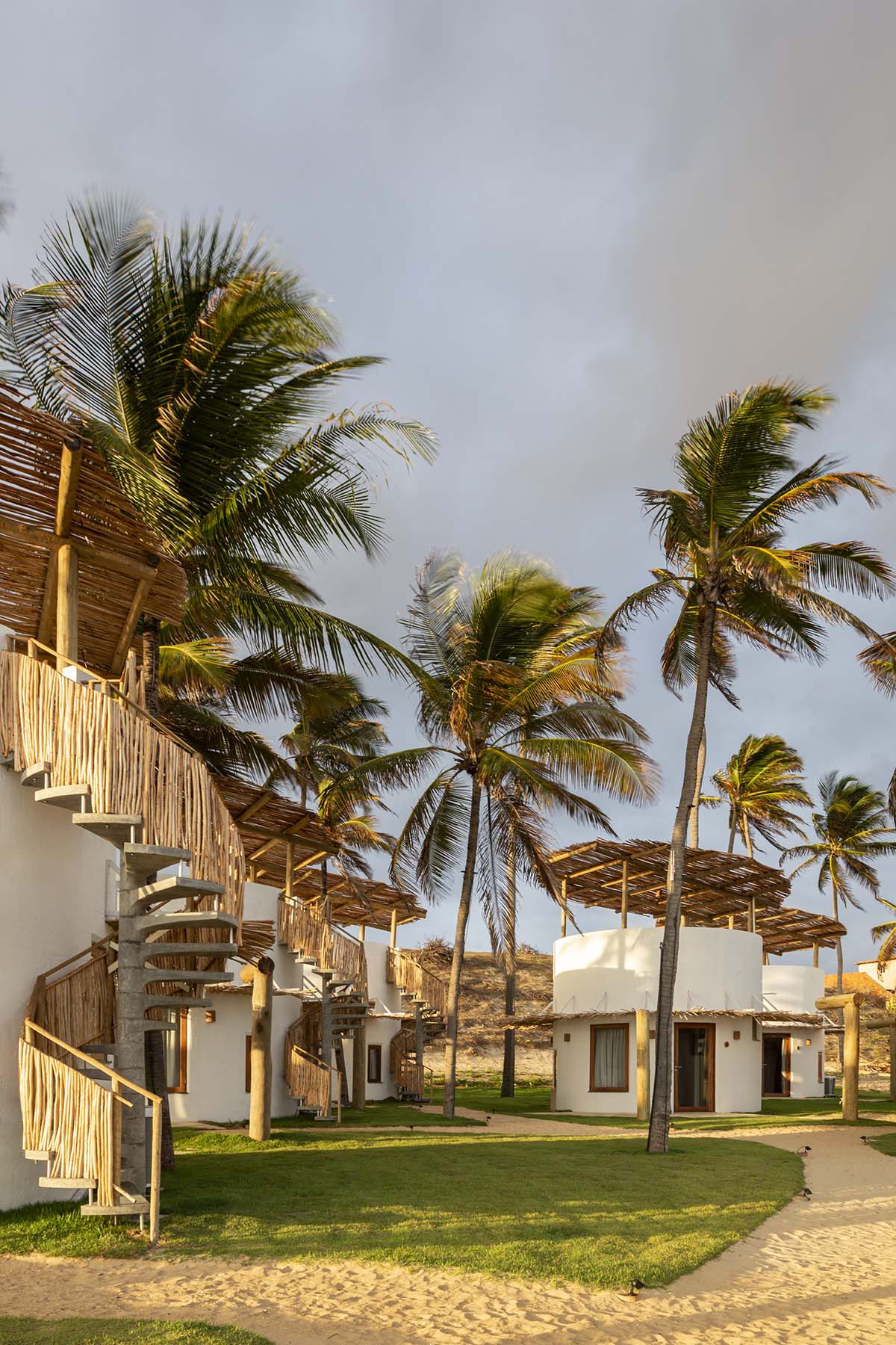 Lins Arquitetos Associados built village comprised of circular chalets overlooking coconut groves 