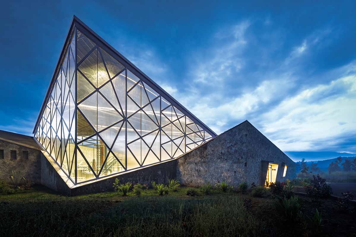 Striking geometric glass geometry resembles an open eye at a distillery in Rwanda