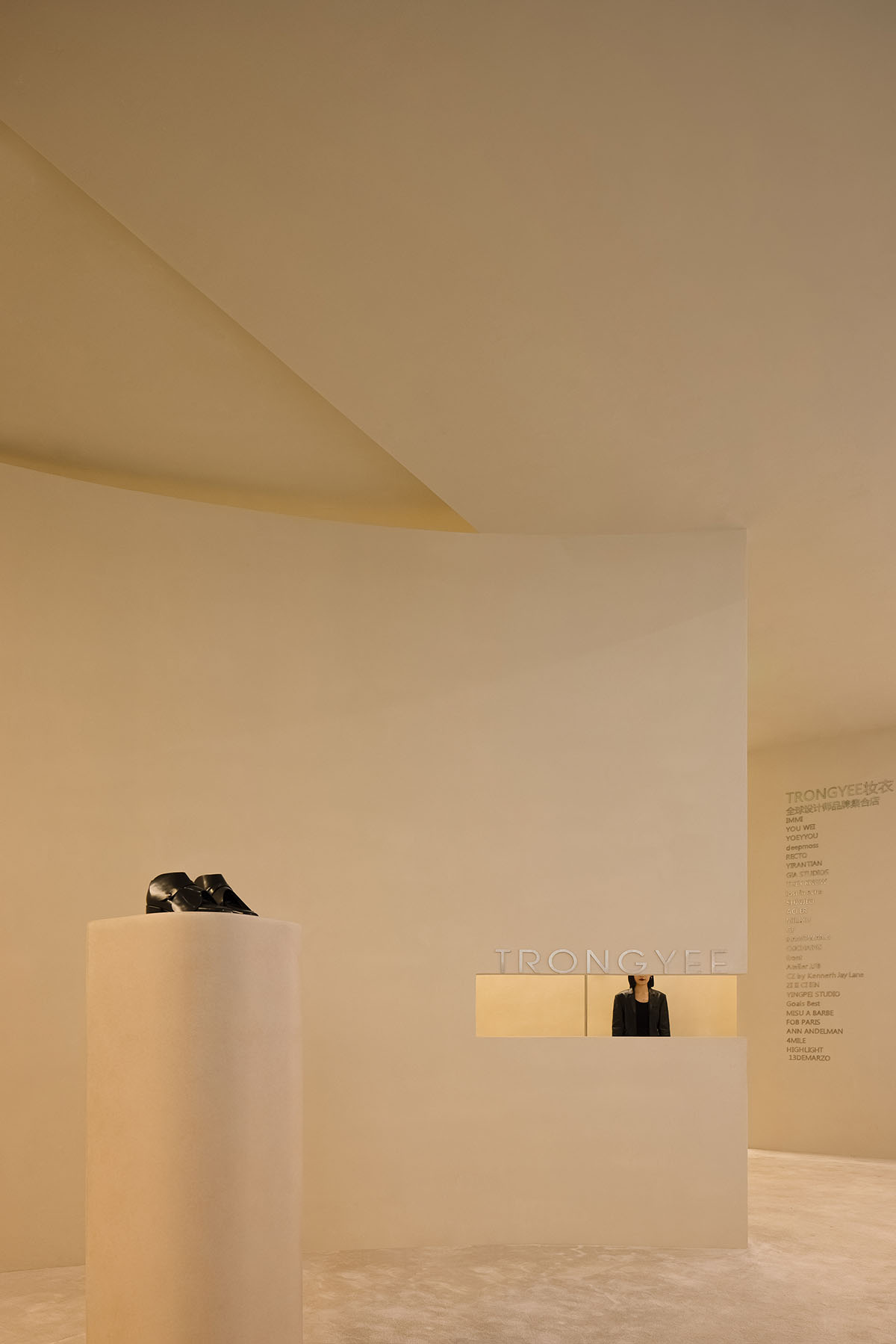 AD ARCHITECTURE designs store with light yellow curved walls that create comfort and softness 