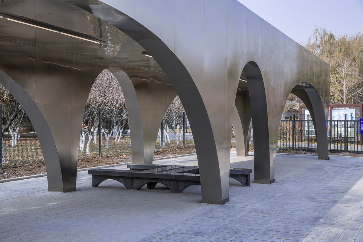 TEMP designs runner's station with stainless steel arcades in Beijing Olympic Forest Park