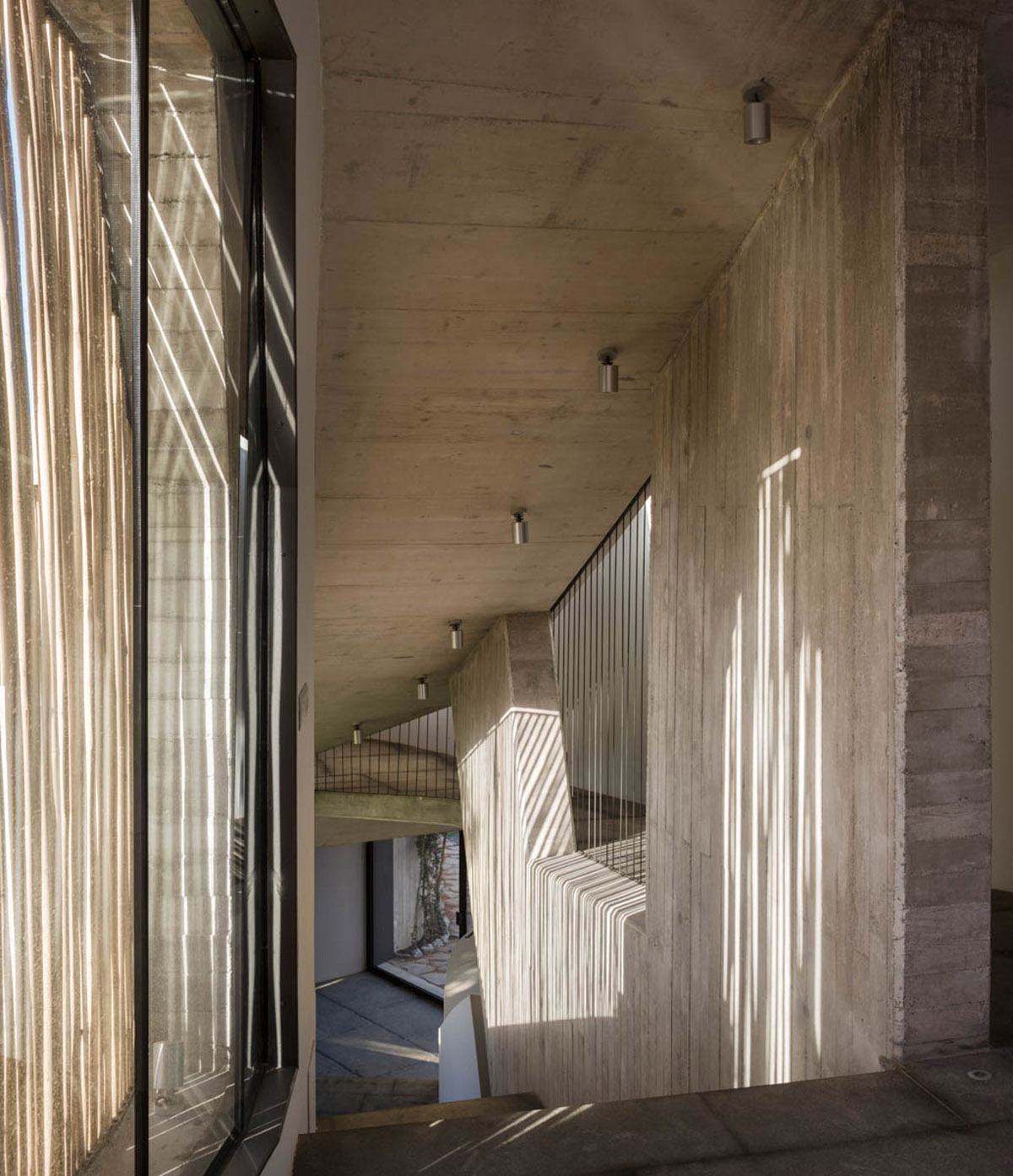 Villa Mediterraneo Ibiza adapts nature with organic form and bamboo shutters