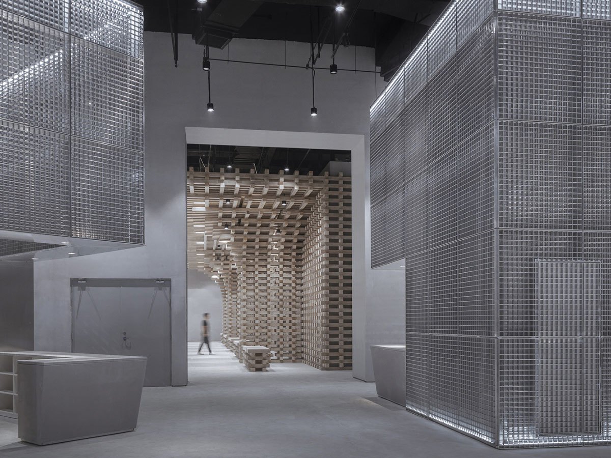 BANDe Architects combines greyscale interior with gridded wooden structures for GreenMonster Lab