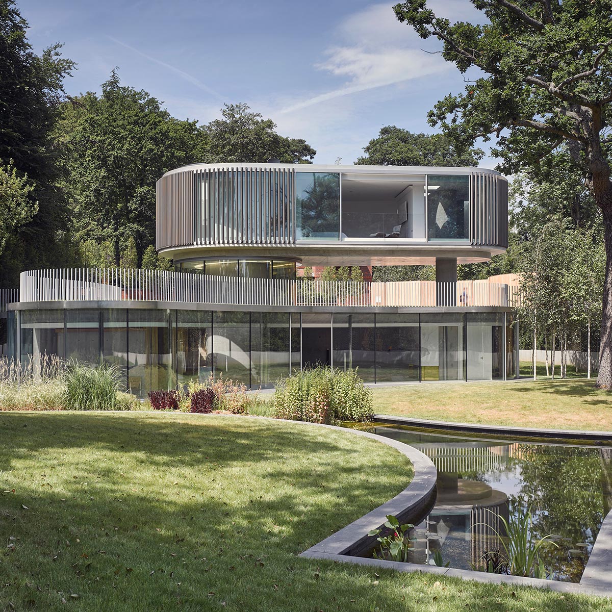 Elegant details and trefoil-shaped garden form this family house by Eldridge London in Coombe Park