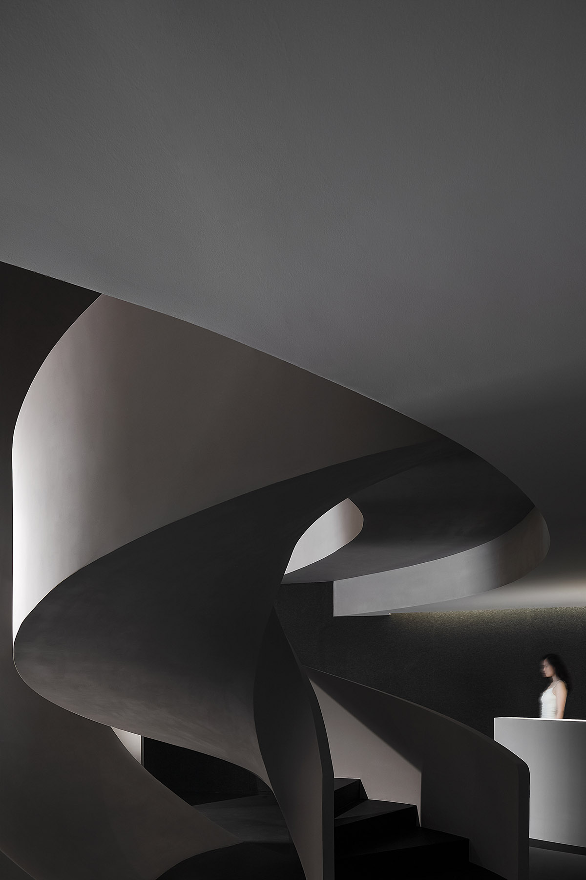 A beauty salon by AD ARCHITECTURE features dark-hued interiors drawing inspiration from cells