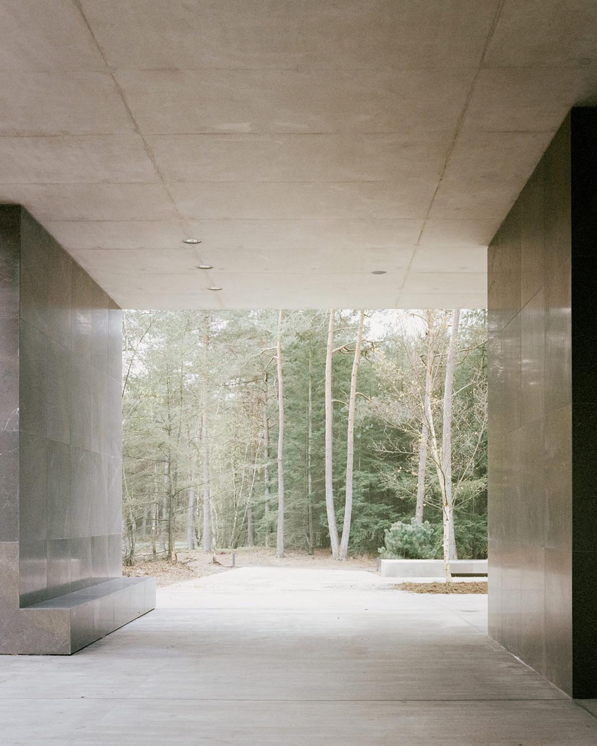 KAAN Architecten built serene Loenen Pavilion commemorating Dutch victims among pine trees