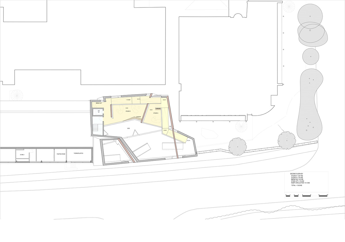 Construction begins on CRAB Studio's orange-colored Innovation Hub at Arts University Bournemouth