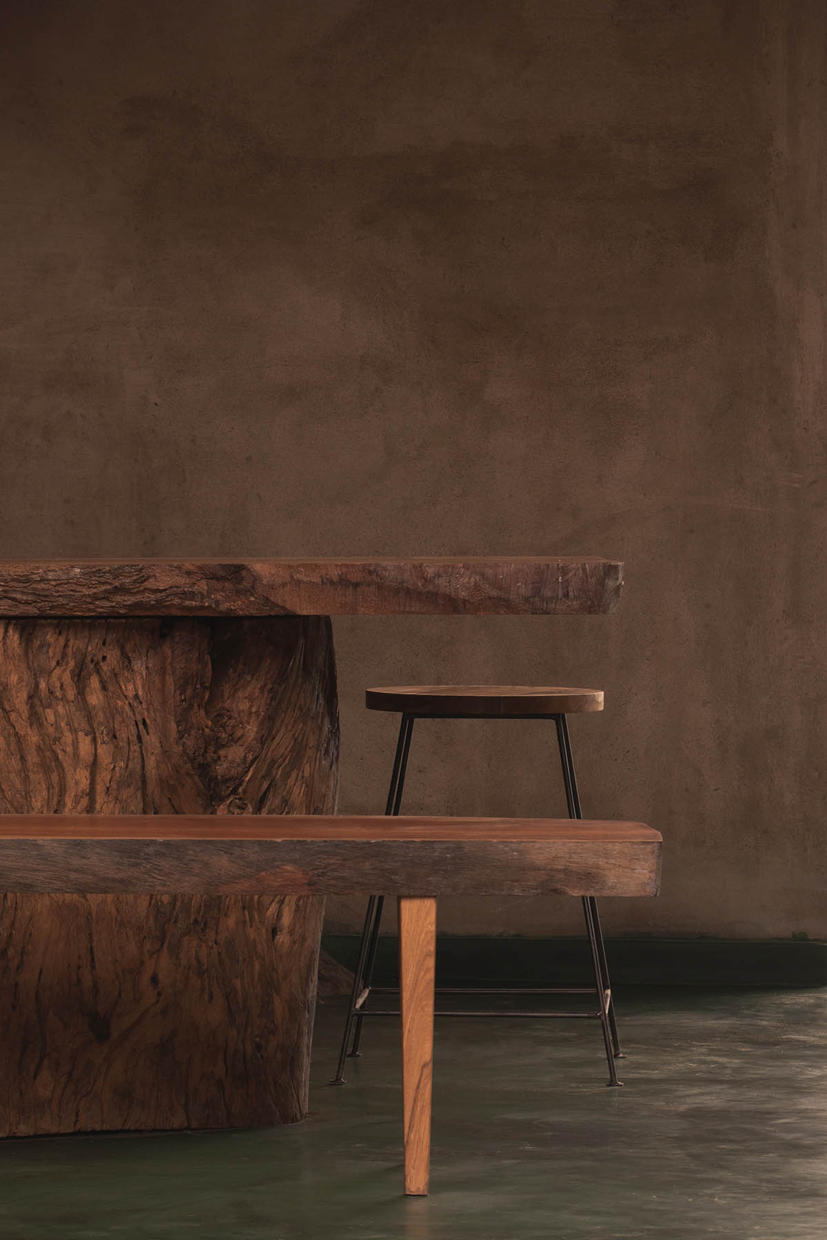 Farm house by Earthscape Studio is wrapped by gabion wall to filter light and airflow in India 