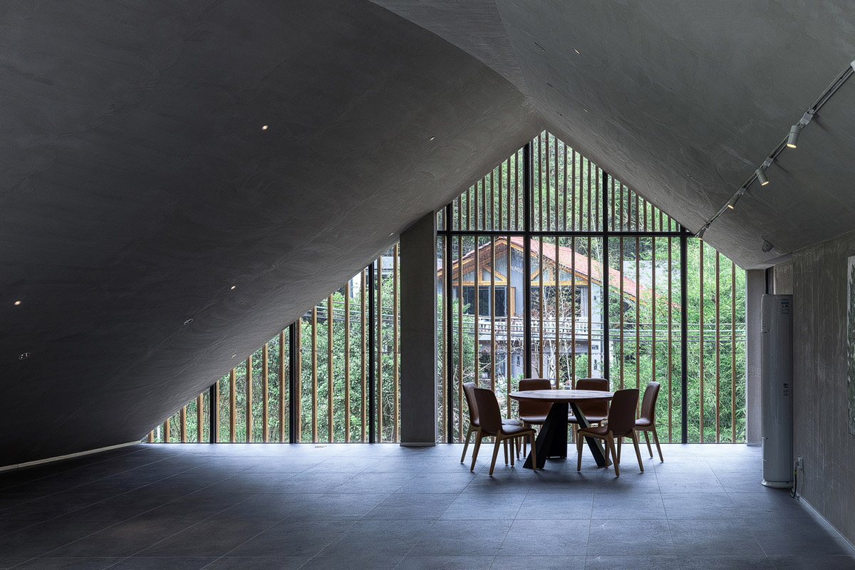 Wildurban Architects completes restaurant with cave-like roof in a forest in Huizhou, China