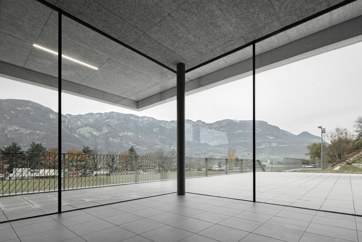 Sports facility by MoDusArchitects makes a bold statement with lighting tower in Bozen, Italy 