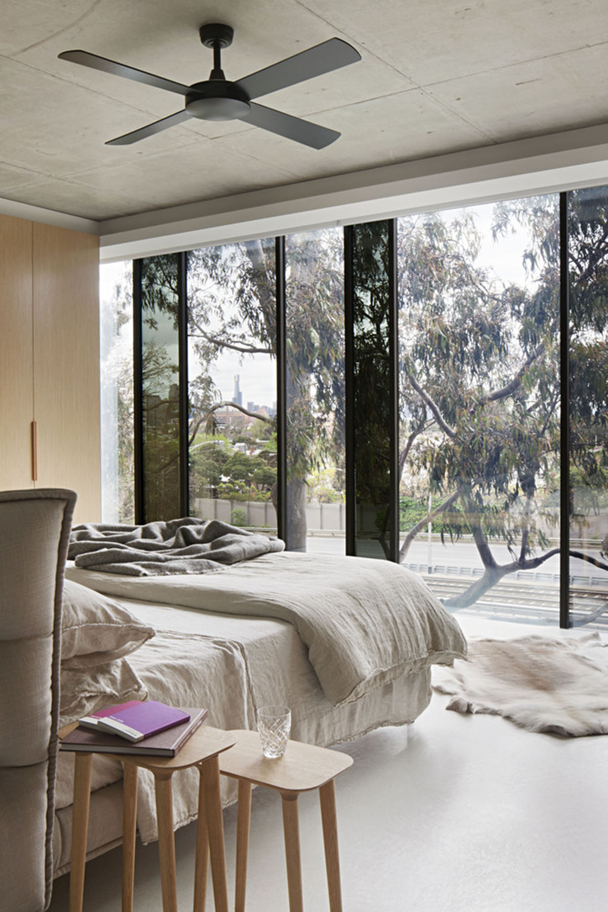 Protruding glass boxes form mixed-use housing in a narrow plot in Melbourne