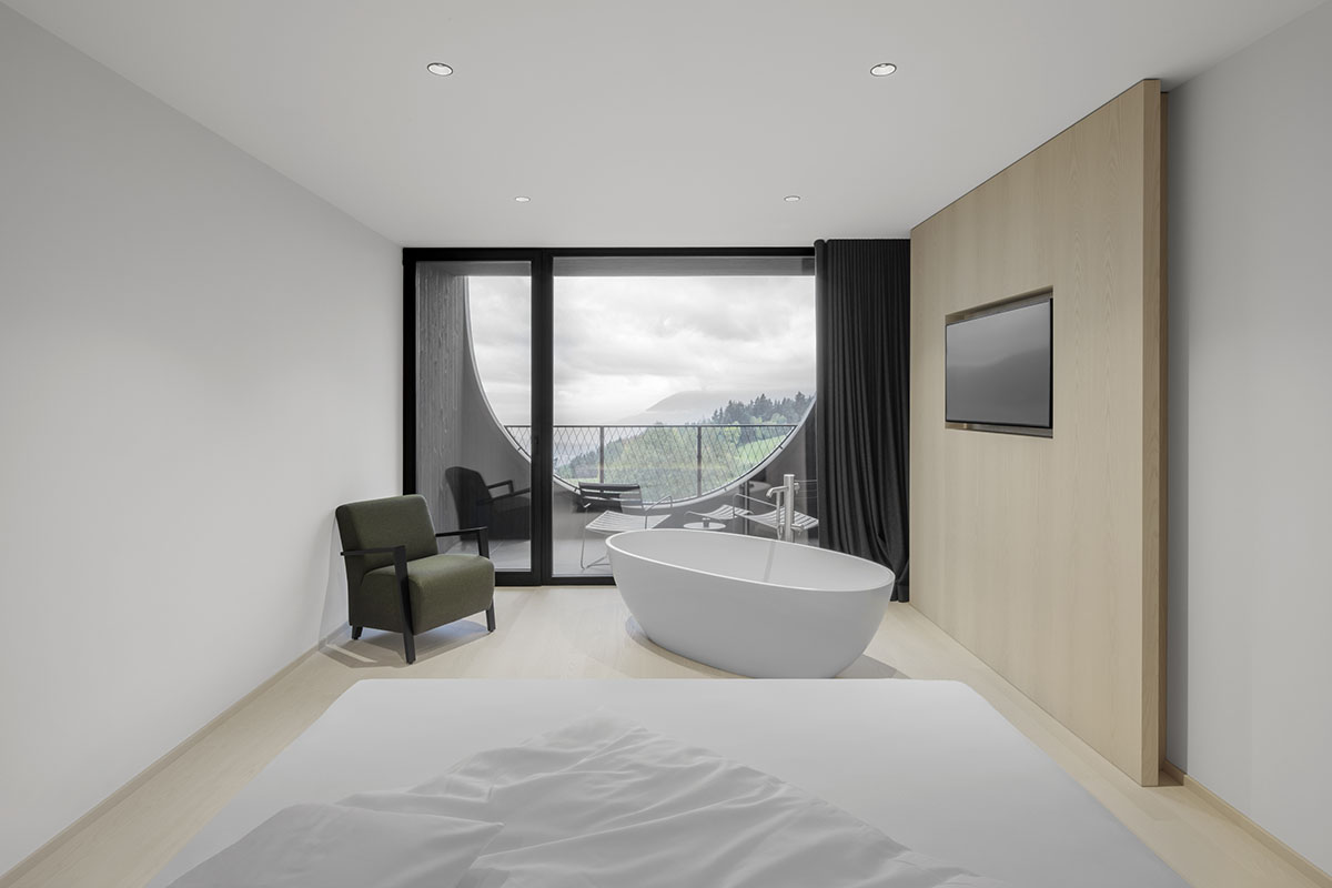 Peter Pichler's Hotel Milla Pontis features black exoskeleton inspired by vernacular architecture