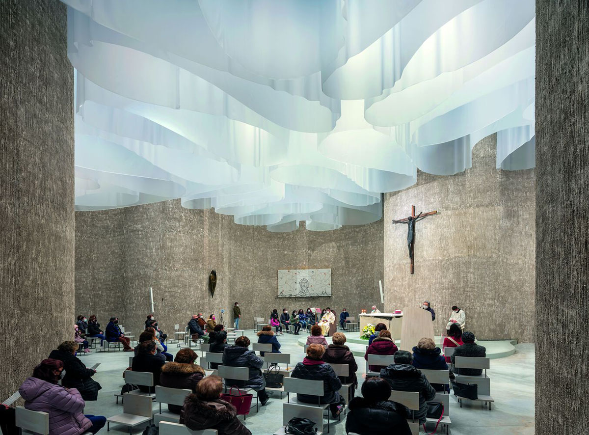 Smooth all-white walls form church designed by Mario Cucinella Architects in Mormanno hill town 
