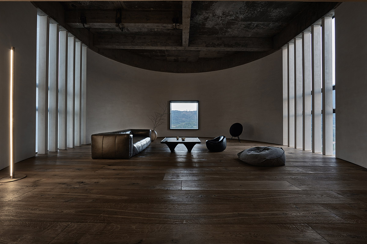 ZMY Design creates earth-toned interiors for a woodwork enthusiast’s house in Fujian, China