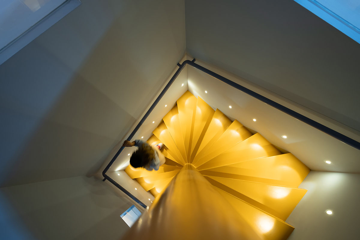 Elementary school library features vibrant colors and playful elements, resembling a fairy tale 