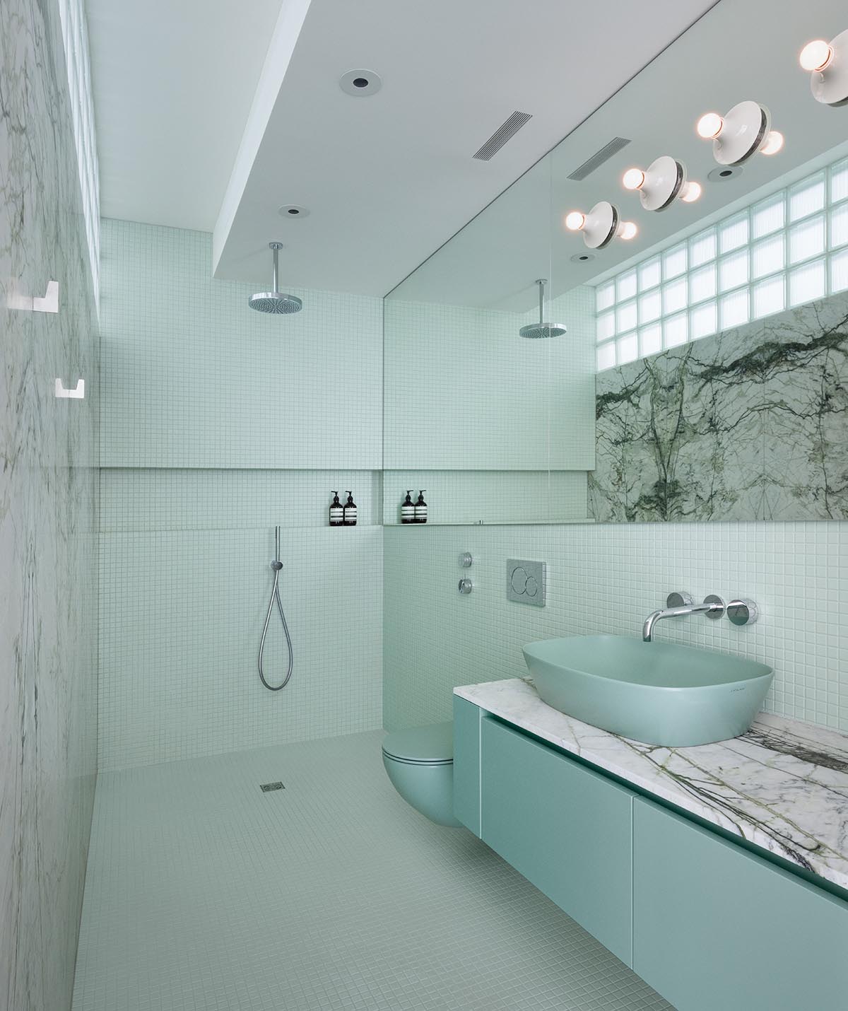 La Firme renovates historic mid-19th-century building with brick walls and oak cabinets in Montreal 