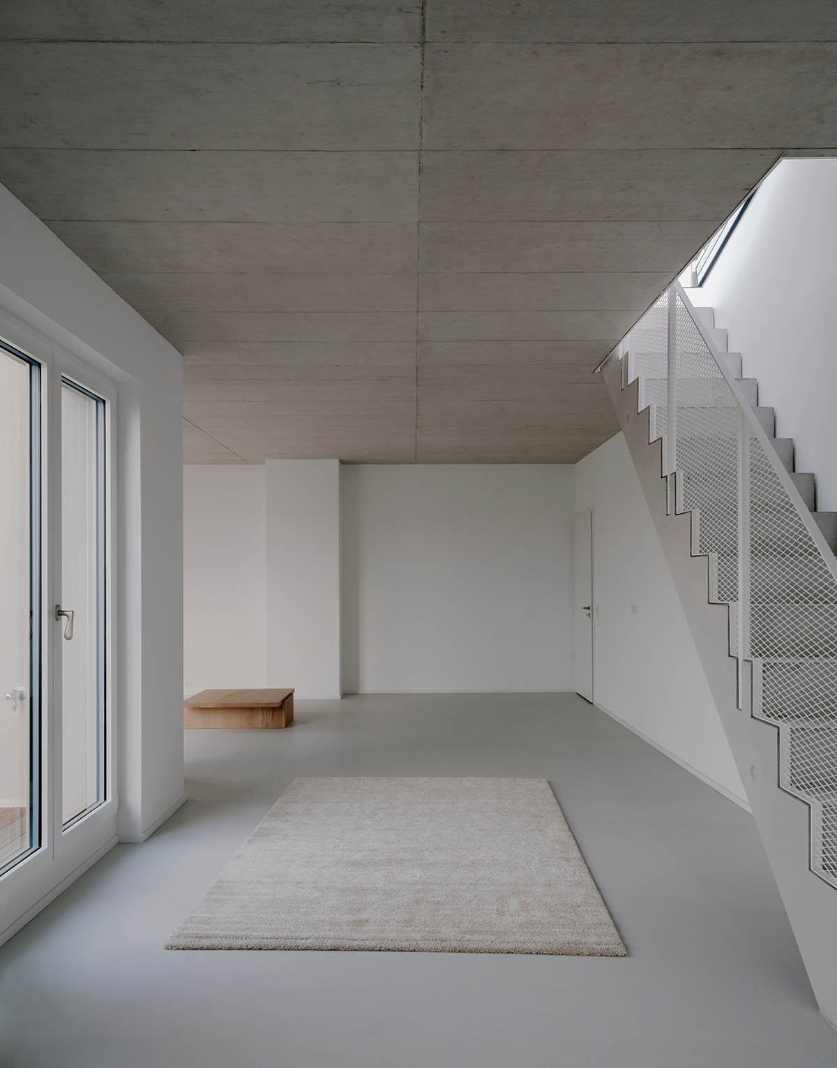 Appels Architekten built new housing featuring sleek and raw interiors in Berlin