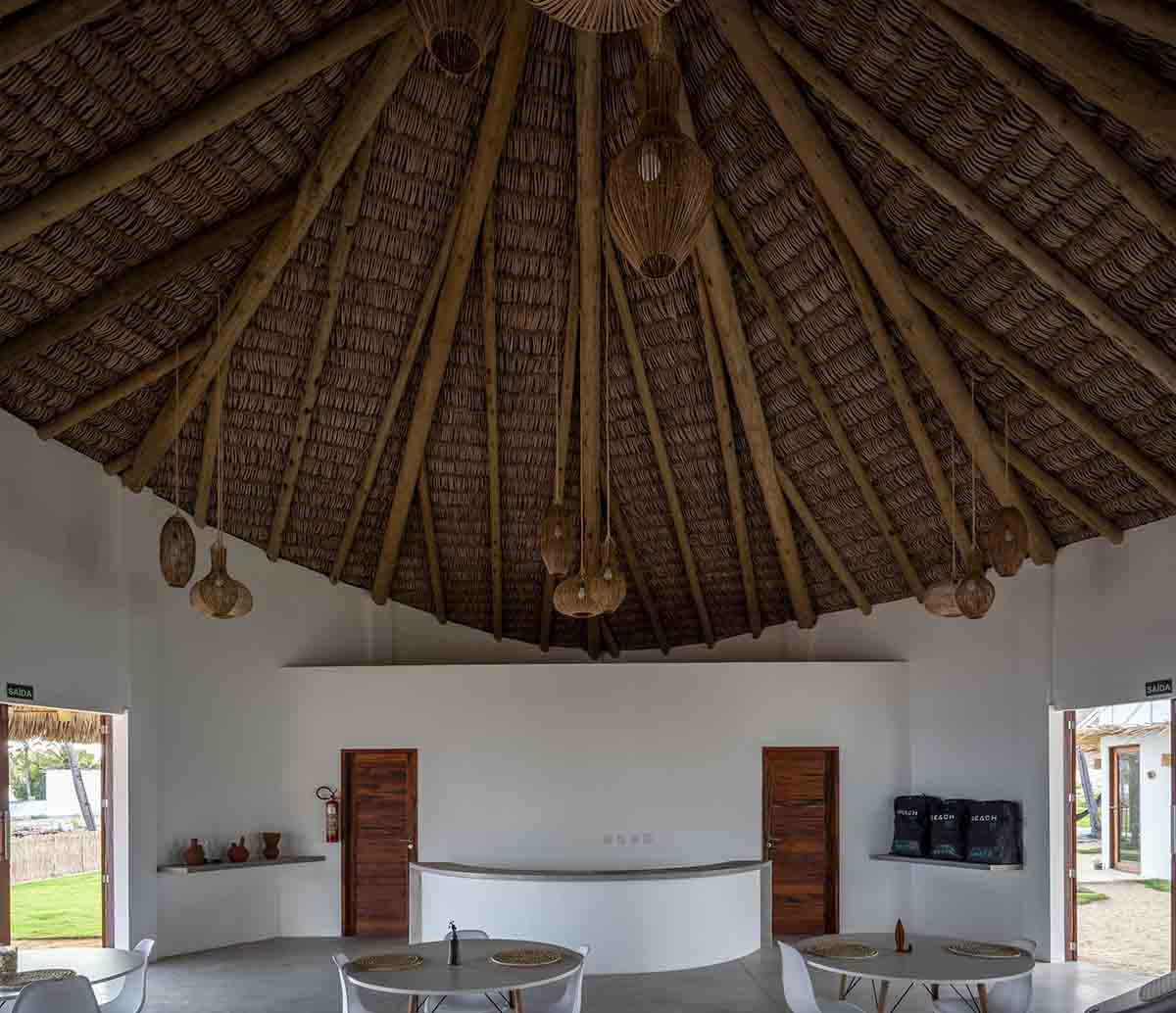 Lins Arquitetos Associados built village comprised of circular chalets overlooking coconut groves 