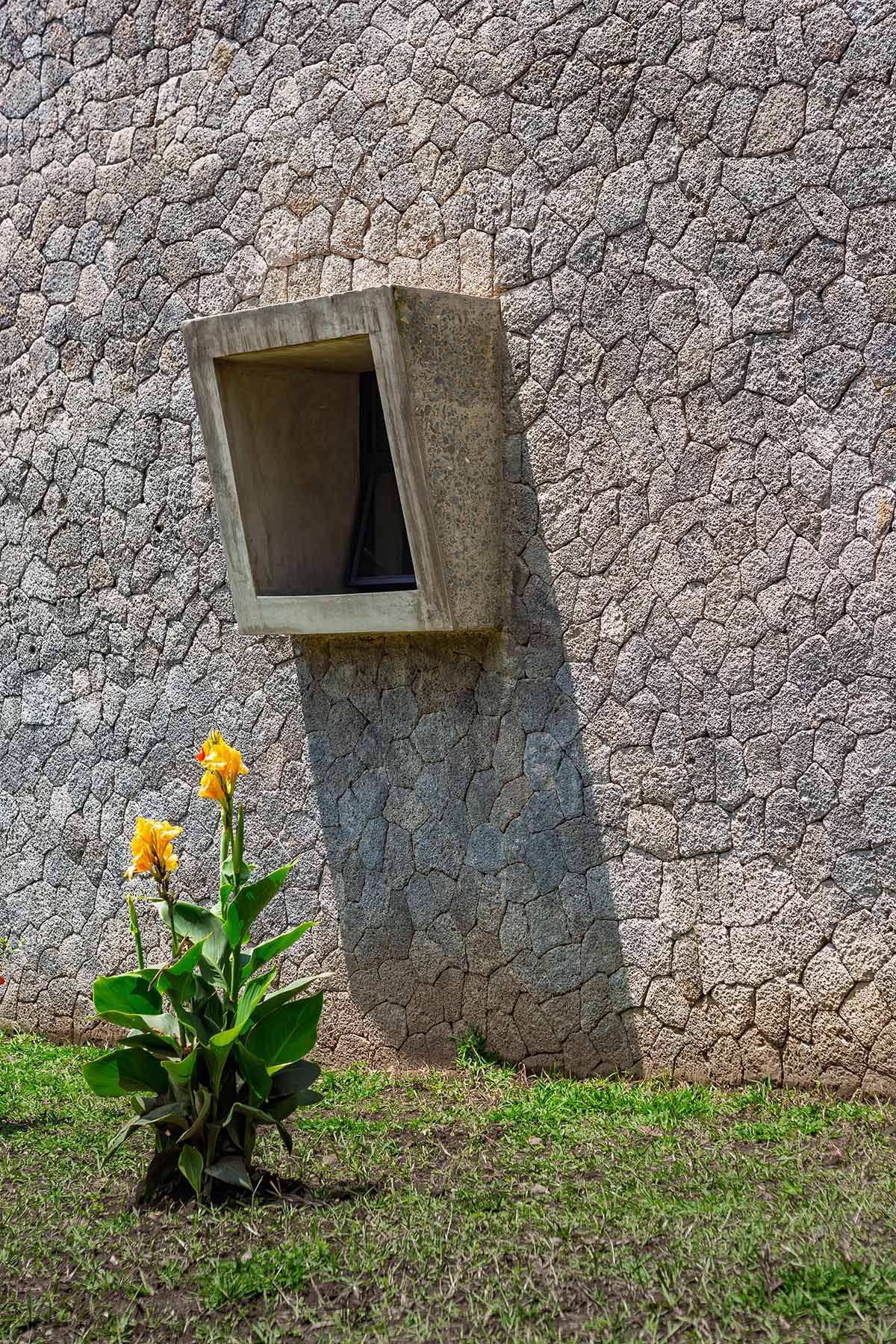 Striking geometric glass geometry resembles an open eye at a distillery in Rwanda