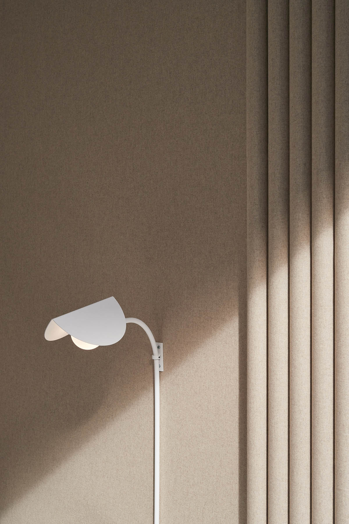 Surgical center features artisanal terracotta brick wall to reverse 