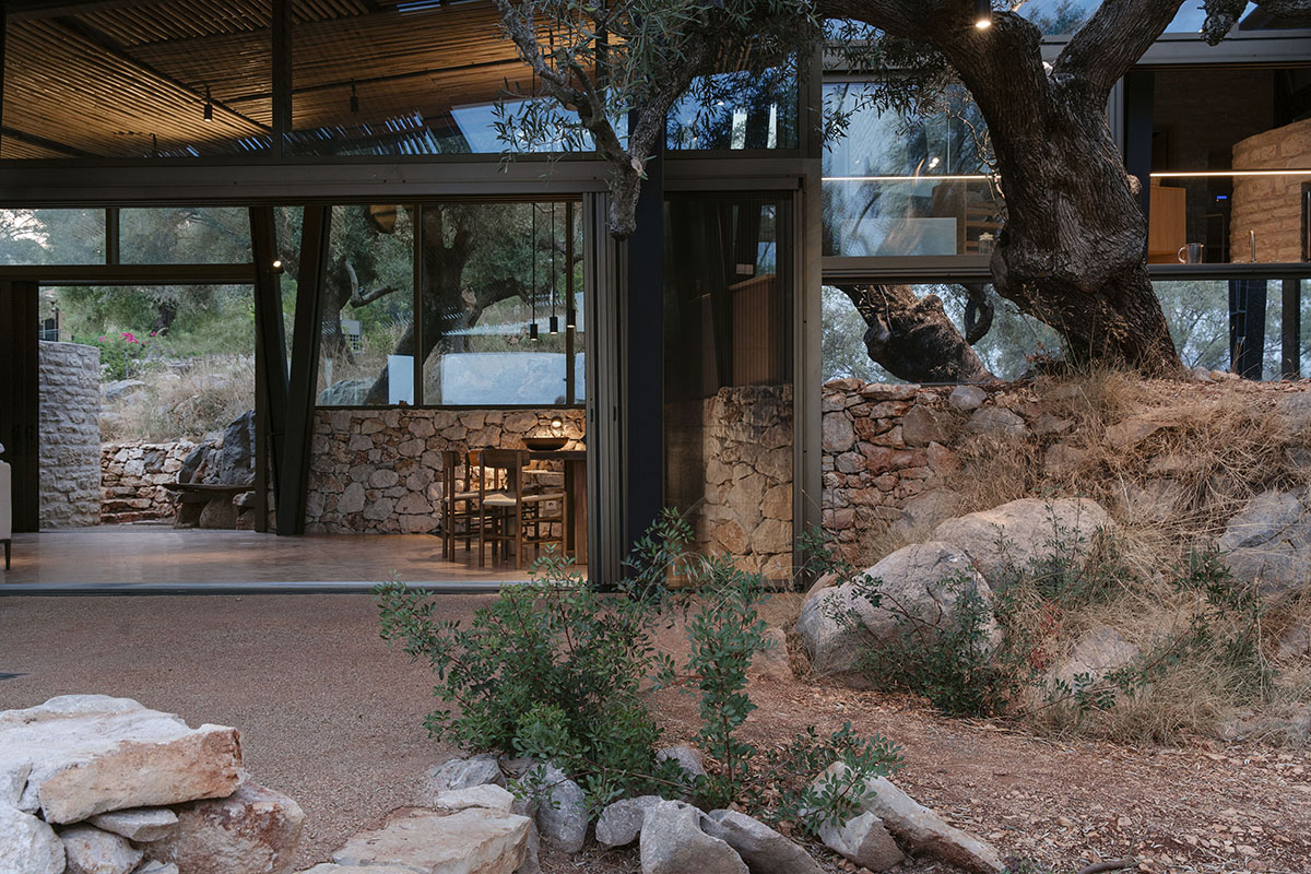 Pastoral round stone dwellings inform Meganisi House by Hiboux Architecture on Meganisi island