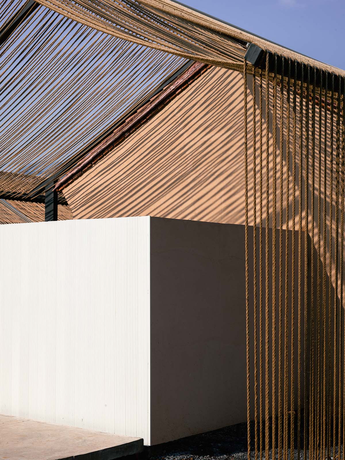 Domain Architects built boutique hotel with thatch roof and 60,000-metre hemp rope in rural Beijing