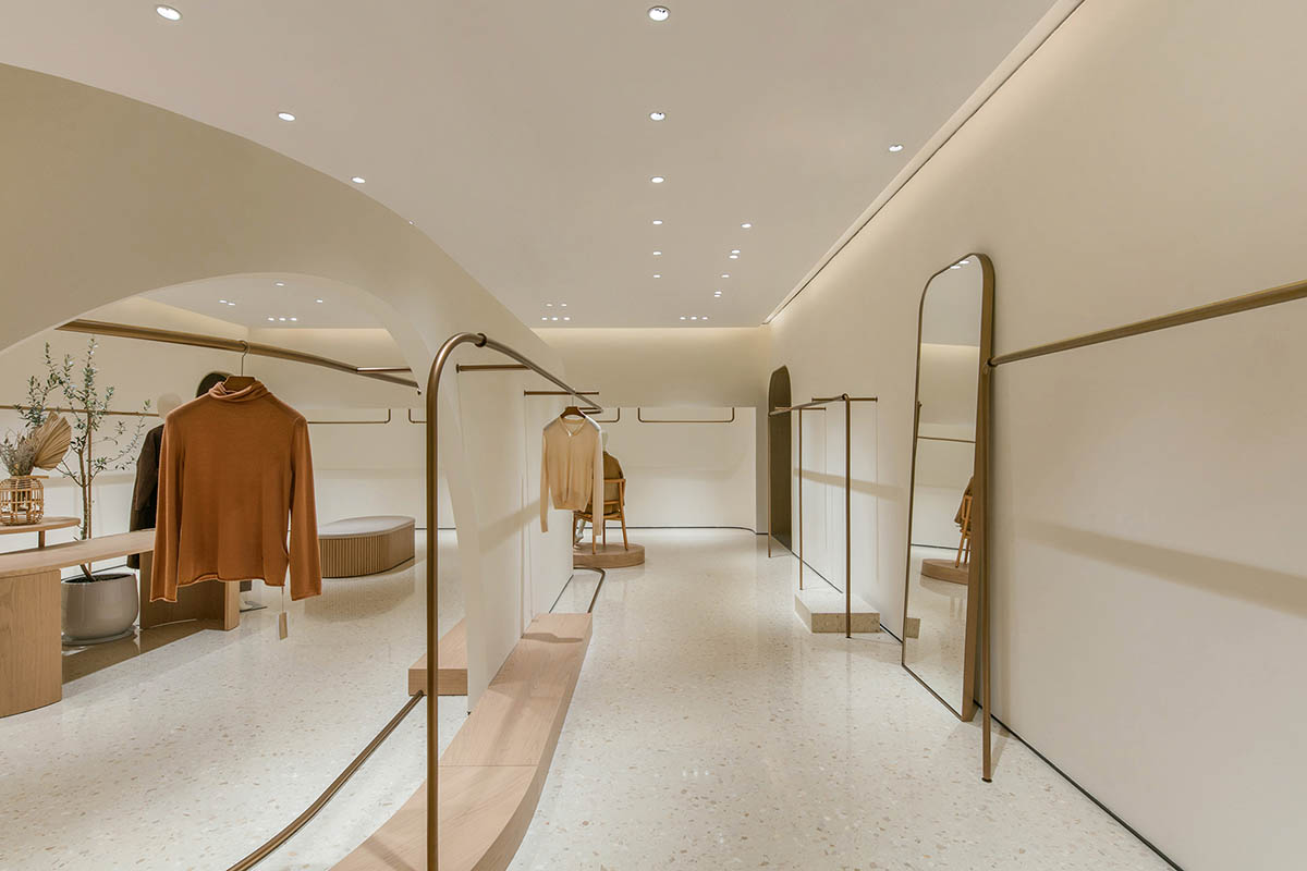 JYDP designs retail space with warm tones and curved walls in Shanghai