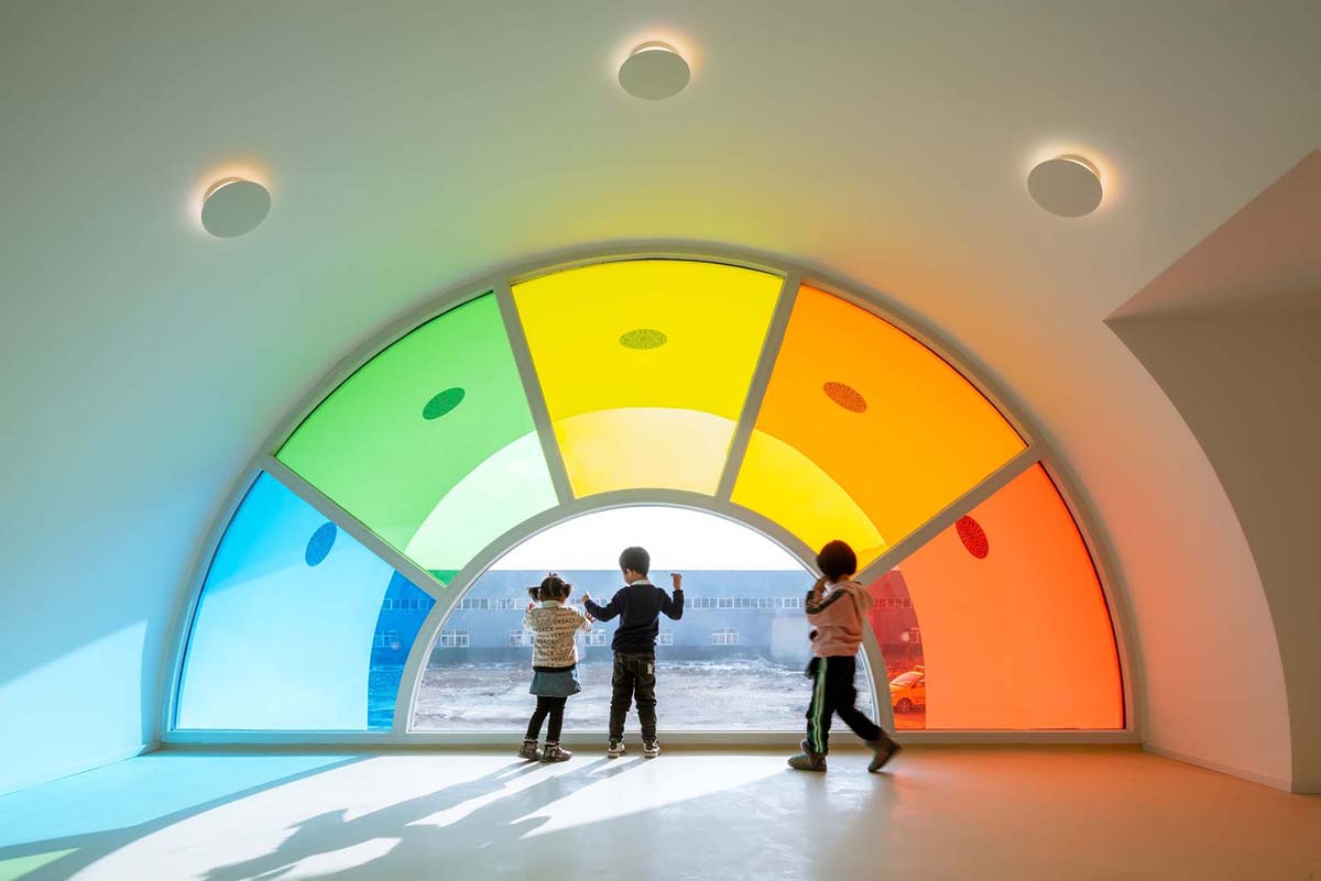 SAKO Architects designs colorful glass doors to evoke children's creativity in this school in China
