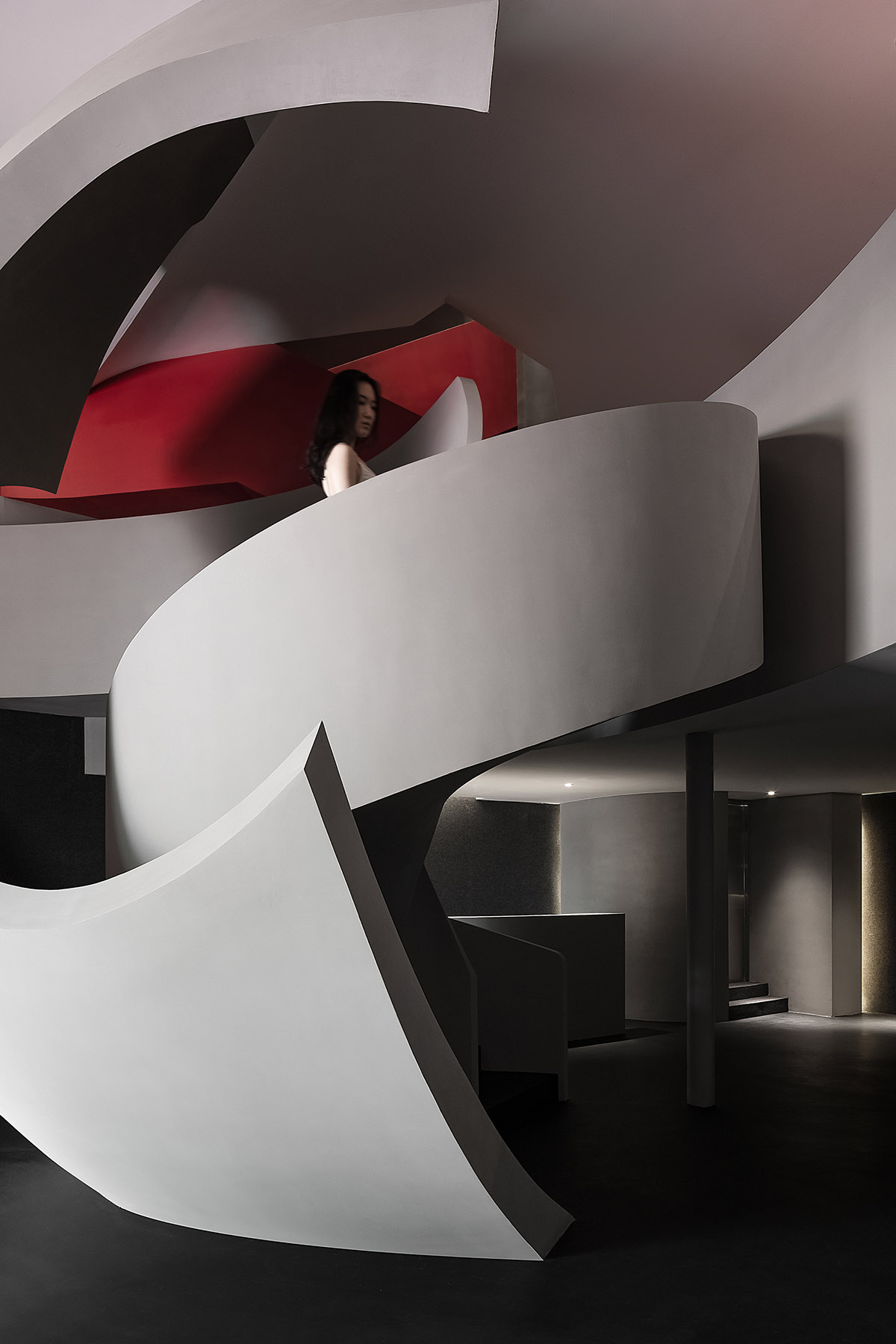 A beauty salon by AD ARCHITECTURE features dark-hued interiors drawing inspiration from cells