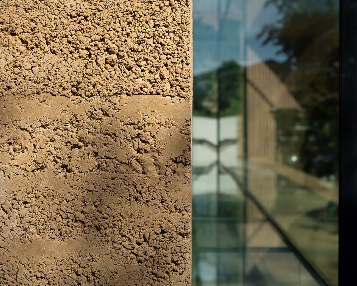 Invisible Studio creates large window for a gymnasium overlooking to a productive garden in Somerset