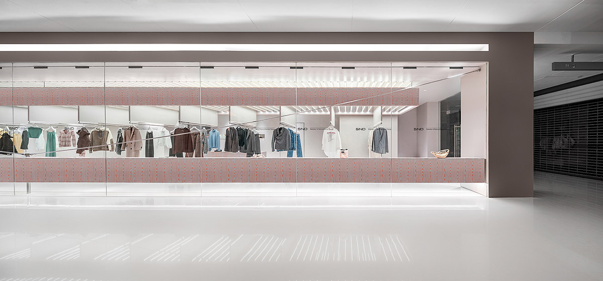 Various Associates creates show-like and pink-hued fashion store under a viaduct in Chongqing